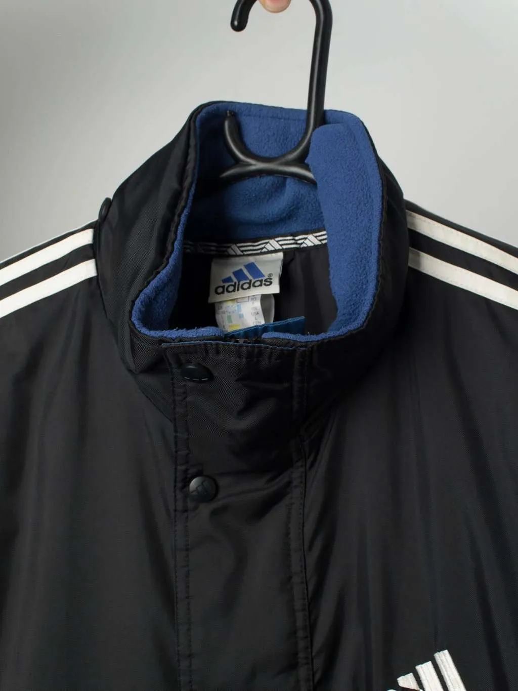 Vintage Adidas padded jacket in black, blue and white – Large / XL